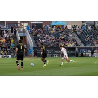 New Mexico United's Kipp Keller and Maliek Howell and Phoenix Rising's Jamison Ping on the field