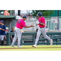Pensacola Blue Wahoos' coach Nelson Prada congratulates Aiva Arquette