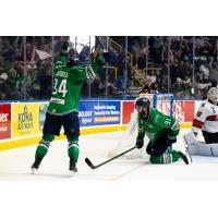 Florida Everblades forwards Hudson Elynuik (right) and Jesse Lansdell celebrate Elynuik's game winner