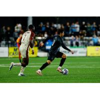 Sacramento Republic FC's Mayele Malango and Colorado Springs Switchbacks FC's Rashed Jahan in action