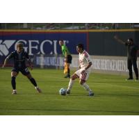 El Paso Locomotive FC's Beto Avila and Phoenix Rising's Diego Gomez on the field