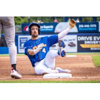 Jackson Cluff of the Syracuse Mets slides into third
