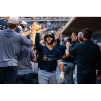 Biscuits Biscuits give high fives to Kenny Piper after his home run