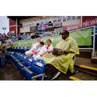 Pensacola Blue Wahoos fans watch through the rain