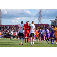 Detroit City FC consoles goalkeeper Carlos Herrera