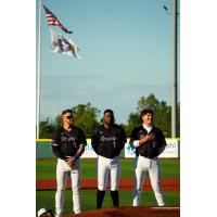 Lake Erie Crushers line up for the National Anthem