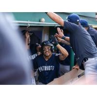 Somerset Patriots congratulate Connor McGinnis in the dugout