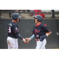 Nolan Geislinger of the St. Cloud Rox is congratulated at home