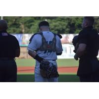 Mississippi Mud Monsters catcher Andrew Semo during the National Anthem
