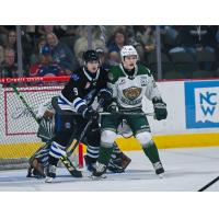 Wenatchee Wild forward Aiden Grossklaus battles for position in front of the Everett Silvertips' net