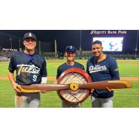 Tulsa Drillers' Chris Newell, Taylor Young, and Christian Suarez holding Propeller Trophy