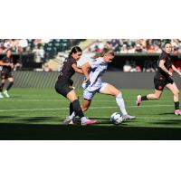 Racing Louisville FC with possession vs. the Portland Thorns