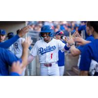 Kendall George is welcomed by Tulsa Drillers teammates