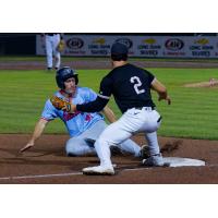Lincoln Saltdogs' Cary Arbolida and Sioux City Explorers' Zac Vooletich in acrion