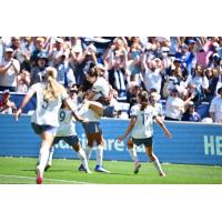 Seattle Reign FC celebrates a goal over the Portland Thorns