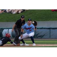 Jake Hjelle of the Lincoln Saltdogs takes a throw at first