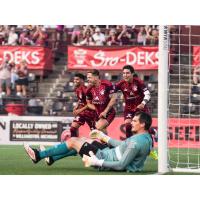 Detroit City FC react following a goal