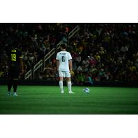 New Mexico United's Zico Bailey and Colorado Springs Switchbacks FC's Sam Williams on the field