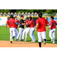 Fayetteville Woodpeckers mob Waner Luciano after his game-winning hit