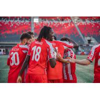 Atlético Ottawa celebrates a goal