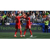 Chicago Fire FC forward Robert Lewandowski (left) and midfielder Maren Haile-Selassie