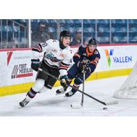 Kelowna Rockets' Braeden Payne and Kamloops Blazers' Owen Cooper in action