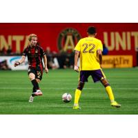 Atlanta United midfielder Adrian Gill (left) vs. Orlando City SC